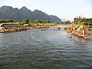 The Construction of River Bars at the Nam Song River at Vang Vieng by Asienreisender