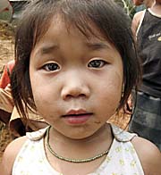 Tribal Girl in a Laotian Village by Asienreisender