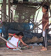 'Kids in a Stilt House Village' by Asienreisender