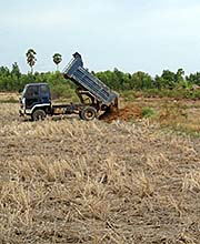 'Land Filling in a Rice Paddy in Cambodia' by Asienreisender